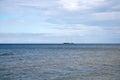 Sailing yacht Black Pearl in the water Baltic sea far on skyline