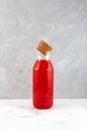 Jus semangka drink in glass bottle on grey background. Fresh Smoothie made from watermelon and melon pulp. Melon and Watermelon Royalty Free Stock Photo