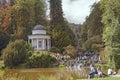 Jussowtempel. People walk in park. Water cascade in Wilhelmshoehe Berg park