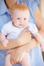 She is just so adorable...An adorable baby girl being held by her mother. Royalty Free Stock Photo