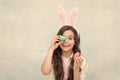 That is just amazing. Happy easter. girl with rabbit ears and eggs. small daughter collect painted eggs. easter egg hunt