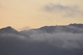 Sun setting with fog rising and a comet passing.