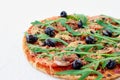 Just baked hot pizza on the white background isolated with free copy space on the left side. Vegetarian pizza with vegetables