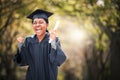 She just cant contain her excitement. Portrait of a young woman cheering on graduation day.