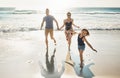 She just cant control herself at the beach. a couple at the beach with their young daughter.