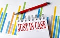 JUST IN CASE text on a notebook with chart and pen business concept Royalty Free Stock Photo
