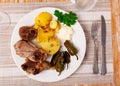 Just cooked portion of grilled lamb leg with potatoes and pepper Royalty Free Stock Photo