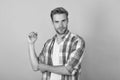 Just cool dude. Handsome dude portrait. Young man roll up shirt sleeves. Serious guy yellow background