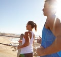 Just do it. a young couple jogging together on the promenade. Royalty Free Stock Photo