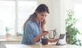 Just enter your card details and its yours. a woman holding her credit card while browsing on her digital tablet. Royalty Free Stock Photo