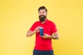 Just fabulous hair. Shampoo for hair type. Make hair stronger. Man cheerful handsome bearded hipster hold bottle shampoo Royalty Free Stock Photo