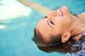 Just floating around. a young woman relaxing in the pool at a spa. Royalty Free Stock Photo