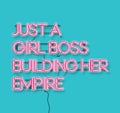 Just a girl boss building her empire pink neon signon blue background. Modern feminism quote isolated on blue background. Modern