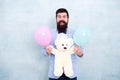 Just happy. gift with love. Stereotypical presents. Romantic man with teddy bear and party balloon. surprise for his Royalty Free Stock Photo