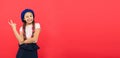 Just having fun. Summer holidays. Kid little cute fashion girl posing with long braids and hat red background. Child