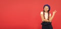 Just having fun. Summer holidays. Kid little cute fashion girl posing with long braids and hat red background. Child