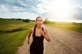 Just keep putting one foot in front of the other. a fit young woman power walking outside on a beautiful day. Royalty Free Stock Photo