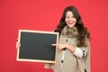 Just look here. happy girl hold empty blackboard. copy space. write your information here. place for advertisement. back Royalty Free Stock Photo