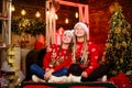 Just look at that. They love Christmas. merry christmas. children having fun. happy small girls at fireplace. New 2020 Royalty Free Stock Photo