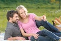 Just look over there! Loving young couple enjoying their intimate picnic Royalty Free Stock Photo