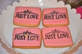 Just love decor on four pink cookies