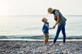 We just love our lake days. a young woman and her son enjoying a walk by the water. Royalty Free Stock Photo