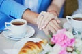 Just married couple holding hands in Parisian cafe Royalty Free Stock Photo
