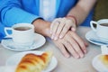 Just married couple holding hands in Parisian cafe Royalty Free Stock Photo