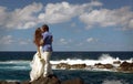 Just married couple kissing on ocean shore on Flores island, Azores Royalty Free Stock Photo