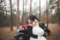 Just married couple in the luxury retro car on their wedding day Royalty Free Stock Photo