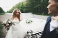 Just married couple in the luxury retro car on their wedding day Royalty Free Stock Photo