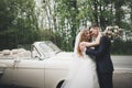 Just married couple in the luxury retro car on their wedding day Royalty Free Stock Photo