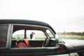 Just married couple in the luxury retro car on their wedding day Royalty Free Stock Photo