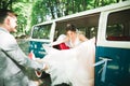 Just married couple in the luxury retro car on their wedding day Royalty Free Stock Photo