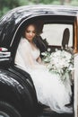 Just married couple in the luxury retro car on their wedding day Royalty Free Stock Photo