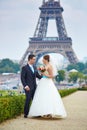 Just married couple in Paris near the Eiffel tower Royalty Free Stock Photo