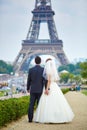 Just married couple in Paris near the Eiffel tower Royalty Free Stock Photo