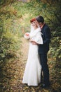 Just married couple posing in an autumn park Royalty Free Stock Photo