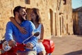 Just married couple riding motor scooter in city Royalty Free Stock Photo