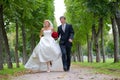 Just Married Couple Walking Fast Down The Path Royalty Free Stock Photo