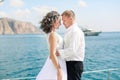 A Just married couple on yacht. Happy bride and groom on their wedding day Royalty Free Stock Photo