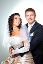 Just married groom and bride on gray Royalty Free Stock Photo