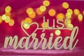 just married inscription on a pink fuchsia background .wedding symbol.