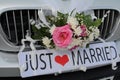Just Married Sign Attached On Car`s Trunk