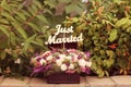 Just married sign in a flower bouquet Royalty Free Stock Photo