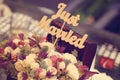 Just married sign in a flower bouquet Royalty Free Stock Photo