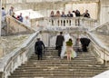 Just married on the stairs