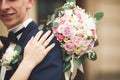 Just married wedding couple posing and bride holding in hands bouquet Royalty Free Stock Photo