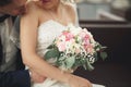 Just married wedding couple posing and bride holding in hands bouquet Royalty Free Stock Photo