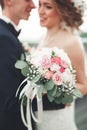 Just married wedding couple posing and bride holding in hands bouquet Royalty Free Stock Photo